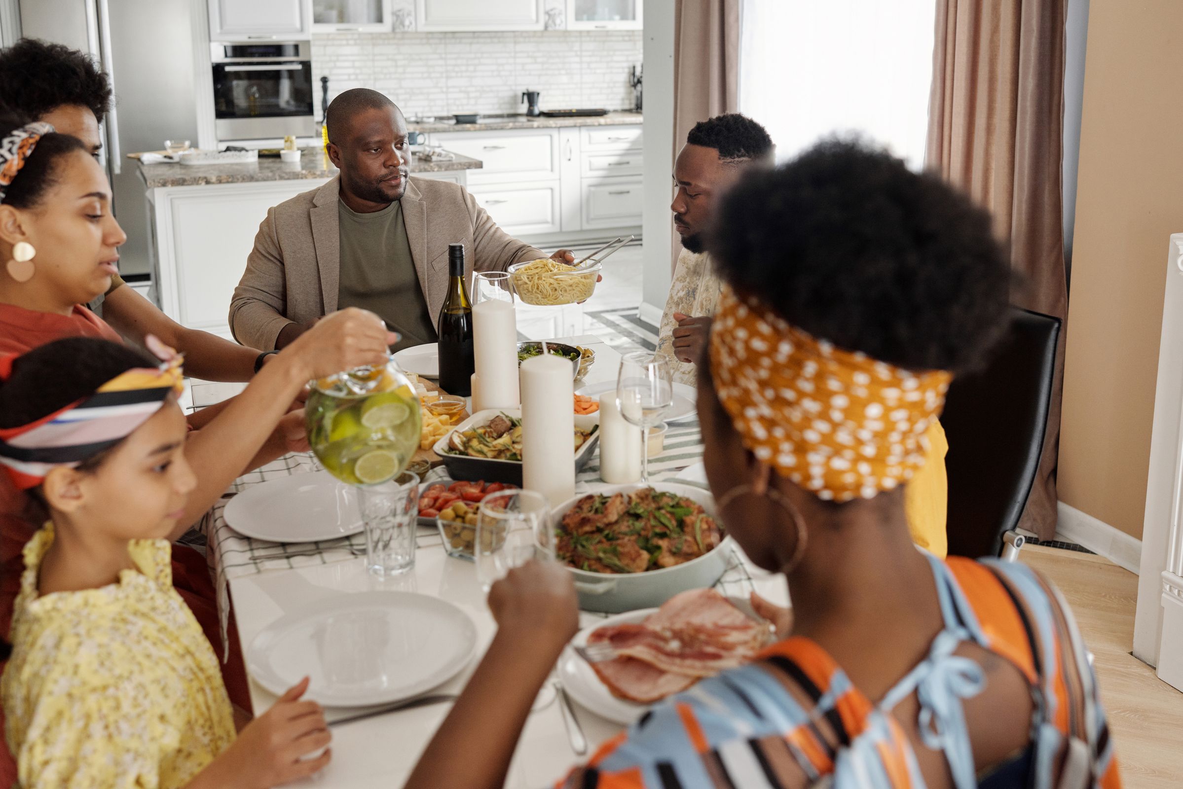 A family enjoying a meal together, representing the quality time that deserves our attention over news