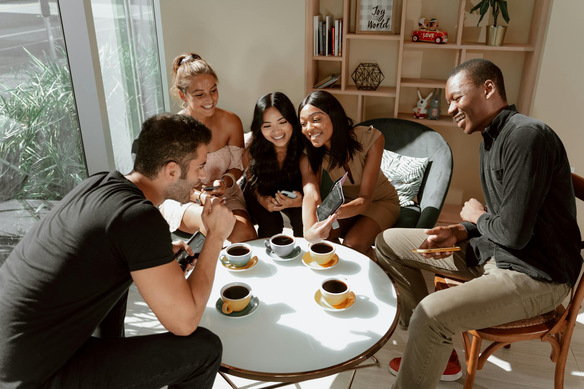 Friends connecting over coffee, representing the local relationships that deserve our real attention