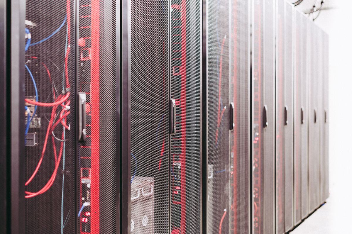 The Second Life of a Mistake: On Public Apologies, Digital Permanence, and Whether We Ever Really Forgive Online 3 Server racks in a data center representing digital permanence and the archive